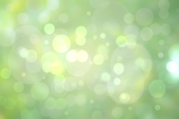 Abstract bright gradient motion spring or summer landscape texture with natural green lights and yellow bright bokeh lights an sun rays. Autumn or summer background with copy space.