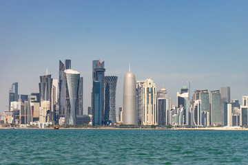 Obraz na płótnie Canvas View of city center with skyscrapers from the other side of sea in Doha, Qatar 