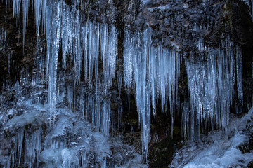 Many icicle on a rock, Bohinj valley - obrazy, fototapety, plakaty