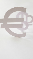 Badges of the currency, cut out of paper. The concept of devaluation of the ruble.