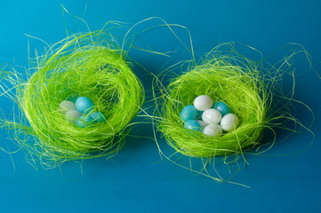 blue and white candy eggs in green nest