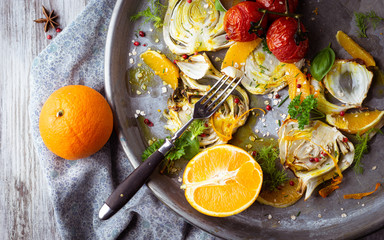 Fototapeta na wymiar fennel and oranges served on a plate, top view, traditional Mediterranean recipe with light and bright colors