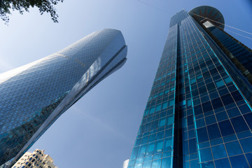 Modern city center with Towers and skyscrapers on sunny sky background. Doha, Qatar 2020