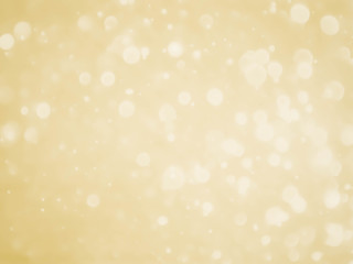 Golden background with soft bokeh lights.