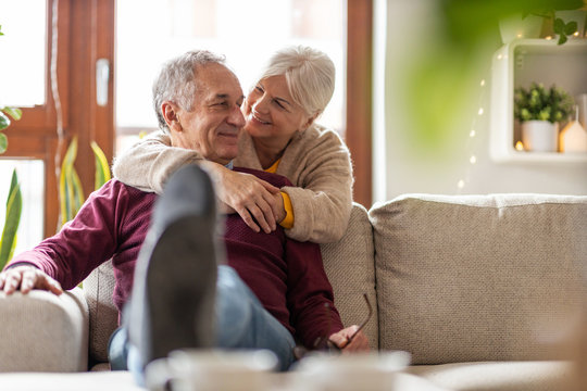Portrait of a happy senior couple relaxing together at home 