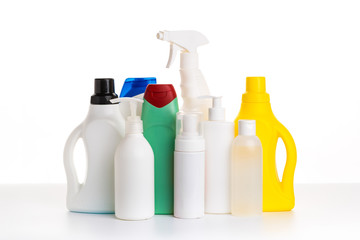 Cleaning product plastic multi-colored container for house clean on white table and isolated. household chemicals