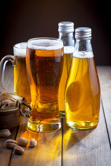 Light beer in a glass, on an old background. 