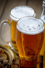 Light beer in a glass on the table