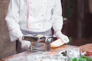 chef cooks spaghetti in a premium restaurant.