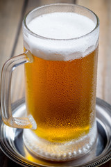 Light beer in a glass on the table
