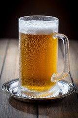 Light beer in a glass on the table