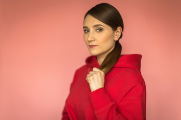 young woman in a bright red hoodie