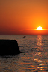 Fototapeta na wymiar Amazing beautiful sunset on the sea coast