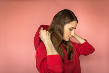 young woman in a bright red hoodie