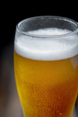 Light beer in a glass on the table