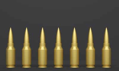 Black studio background with overhead lighting and bullets in a row. 3d rendering
