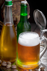 Light beer in a glass, on an old background. 