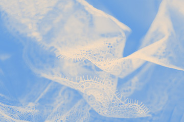 Pastel silk lace lingerie, ivory color, light blue background