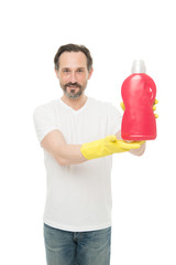 Fototapeta na wymiar Doing laundry. Product for cleaning. Man rubber gloves hold plastic bottle liquid soap chemical cleaning agent. Bearded mature guy cleaning home. Cleanup concept. The key to cleanliness in house