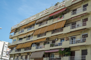 Obraz premium on the streets of Athens with blocks of flats and shops, Greece