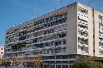 on the streets of Athens with blocks of flats and shops, Greece