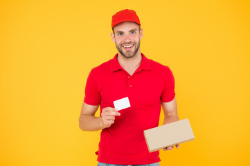 Unique offer. Man red cap yellow background. Delivering purchase. Delivered to your destination. Service delivery. Courier and delivery. Postman delivery worker. Discount card. Glad to serve