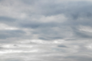 Dramatic sky with gray thick storm clouds_