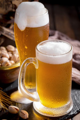 Light beer in a glass on the table