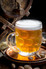 Light beer in a glass on the table