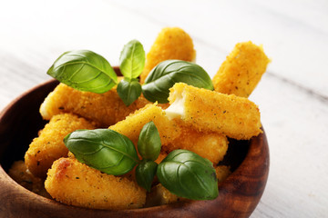 Breaded mozzarella cheese sticks with tomato ketchup