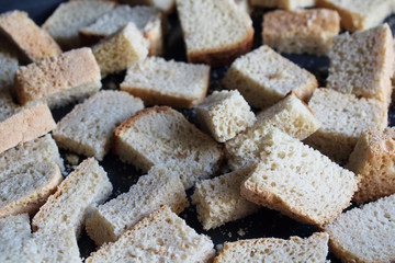 Dried white bread. Large crackers. Close-up. Top view. Background. Texture.