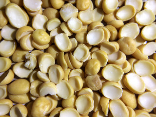 Yellow split dried peas background. Horizental. Close up.