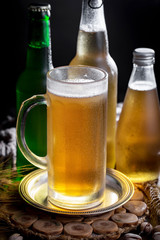 Light beer in a glass, on an old background.