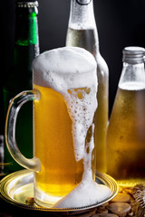 Light beer in a glass, on an old background.