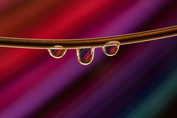 Colored stripes in a drop of water