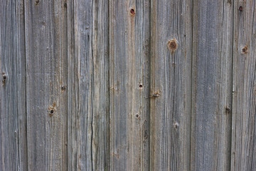 Background of old boards. Wooden old fence close-up.