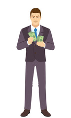 Smiling Businessman counts the money. Full length portrait of Businessman in a flat style.