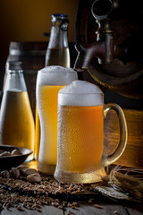 Light beer in a glass on a table in composition with accessories on an old background