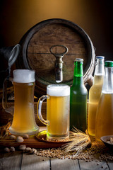 Light beer in a glass, on an old background.
