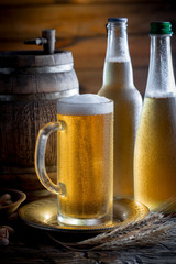 Light beer in a glass on a table in composition with accessories on an old background