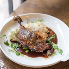Crispy Duck Leg Confit with Potato Gratin and Red Wine Sauce