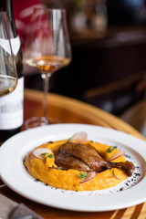 Duck Leg Confit with Pumpkin Puree and Red Wine Sauce