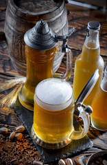 Light beer in a glass, on an old background.