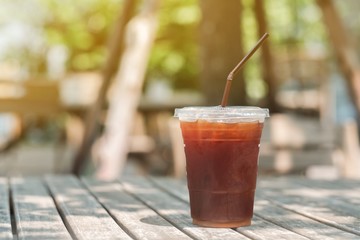 A glass of ice americano coffee in cafe