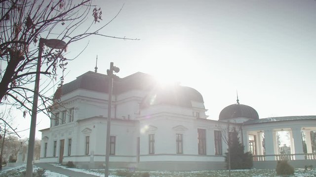 Slow motion shot of the restored old casino building in Cluj. Romania. Sunny winter day
