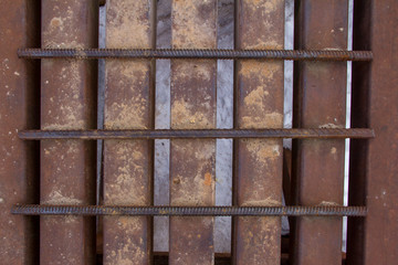 Metal grille from rods. Background of steel beams and rods