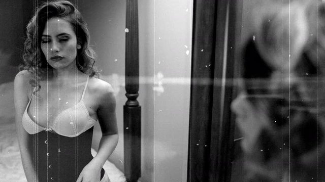 beautiful woman in lingerie reflected in mirror