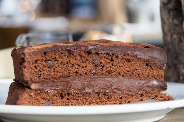 close up chocolate cake on white plate