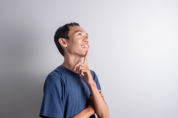 happy young asian man. young asian man who dreams about all his ideals