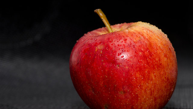 Apple on a black bagground